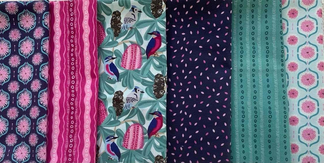 A selection of Australiana native fabric featuring various floral and geometric patterns in green pink and blue