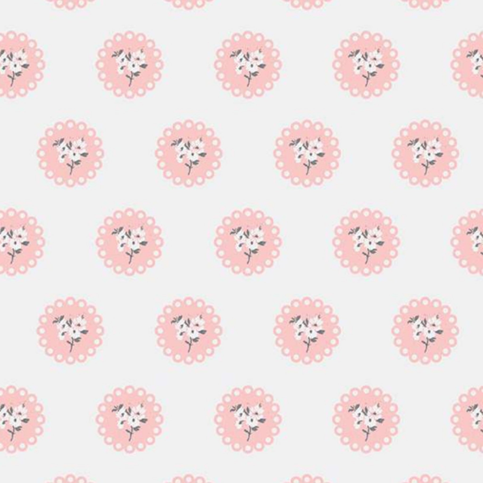Off-white quilting cotton with a delicate pink floral doily pattern