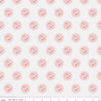 Pattern of pink flowers with scalloped edges on an off-white background
