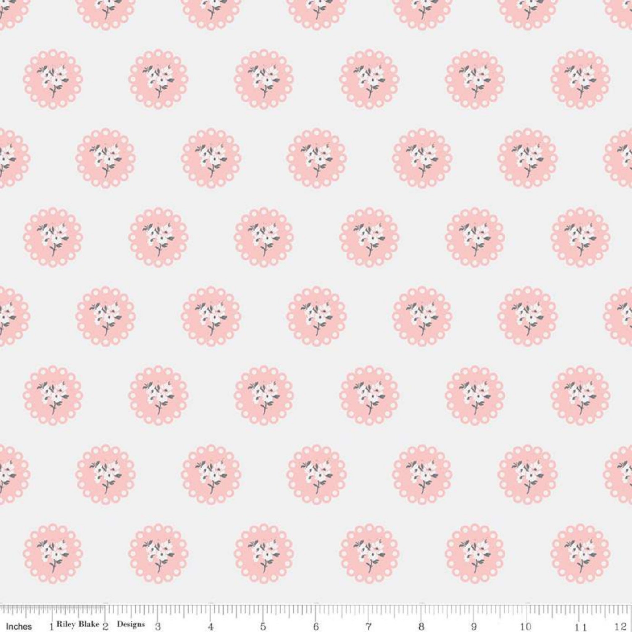 Pattern of pink flowers with scalloped edges on an off-white background