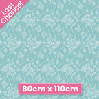 Aqua quilting cotton with a delicate white pattern of floral stems and berries