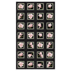 Quilting panel with 24 blocks of blush pink magnolias framed on a black background