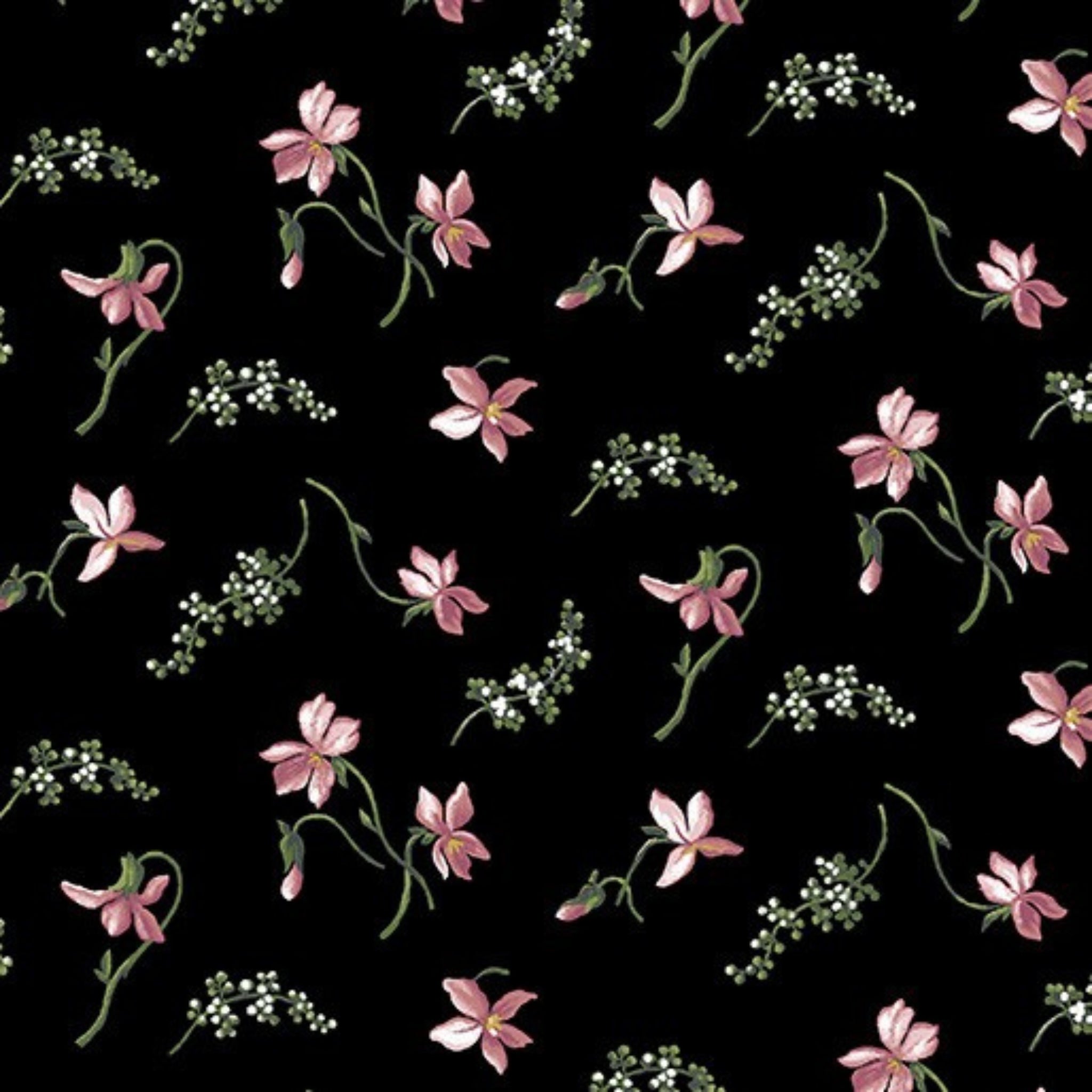 Quilting fabric with small, scattered coral-pink magnolia blossoms on a black background