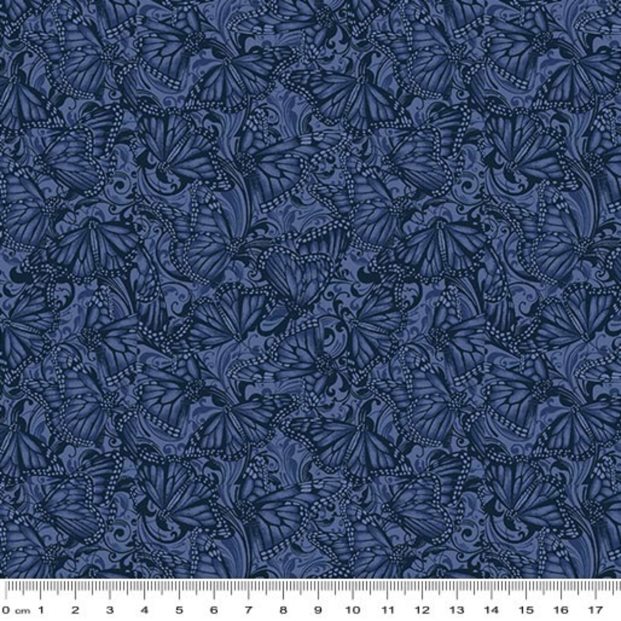 Tonal quilting fabric with detailed Monarch butterflies and scrollwork pattern in deep indigo blue