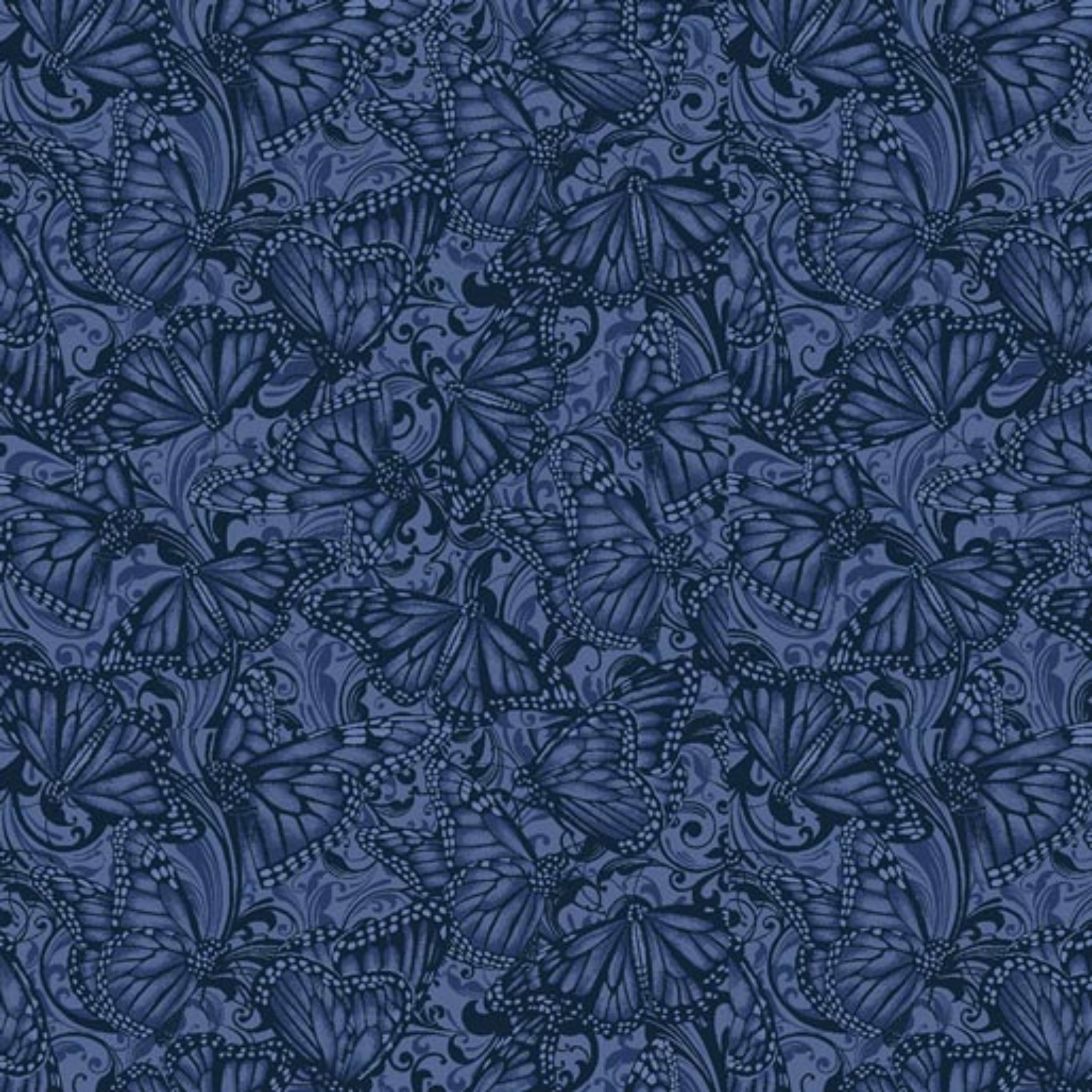 Tonal quilting fabric with detailed Monarch butterflies and scrollwork pattern in deep indigo blue