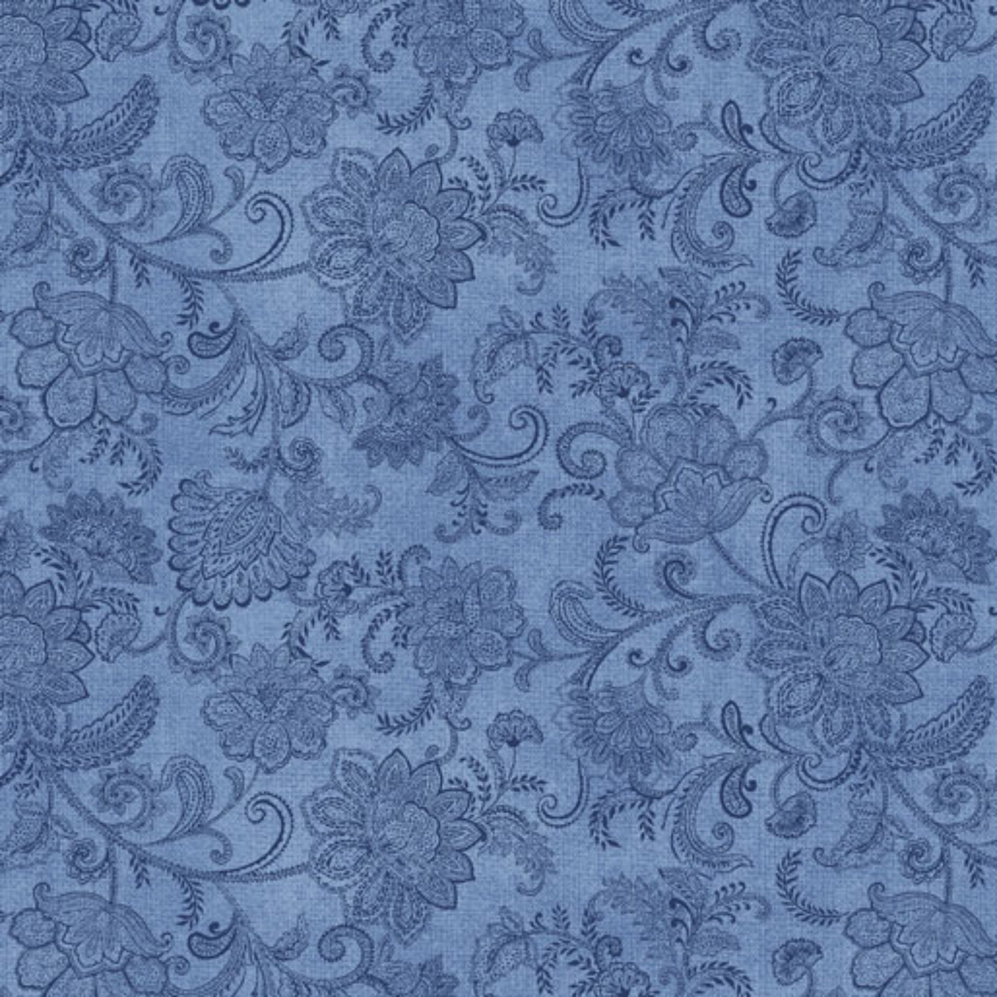 Tonal medium blue quilting fabric with a detailed all-over Jacobean floral paisley pattern