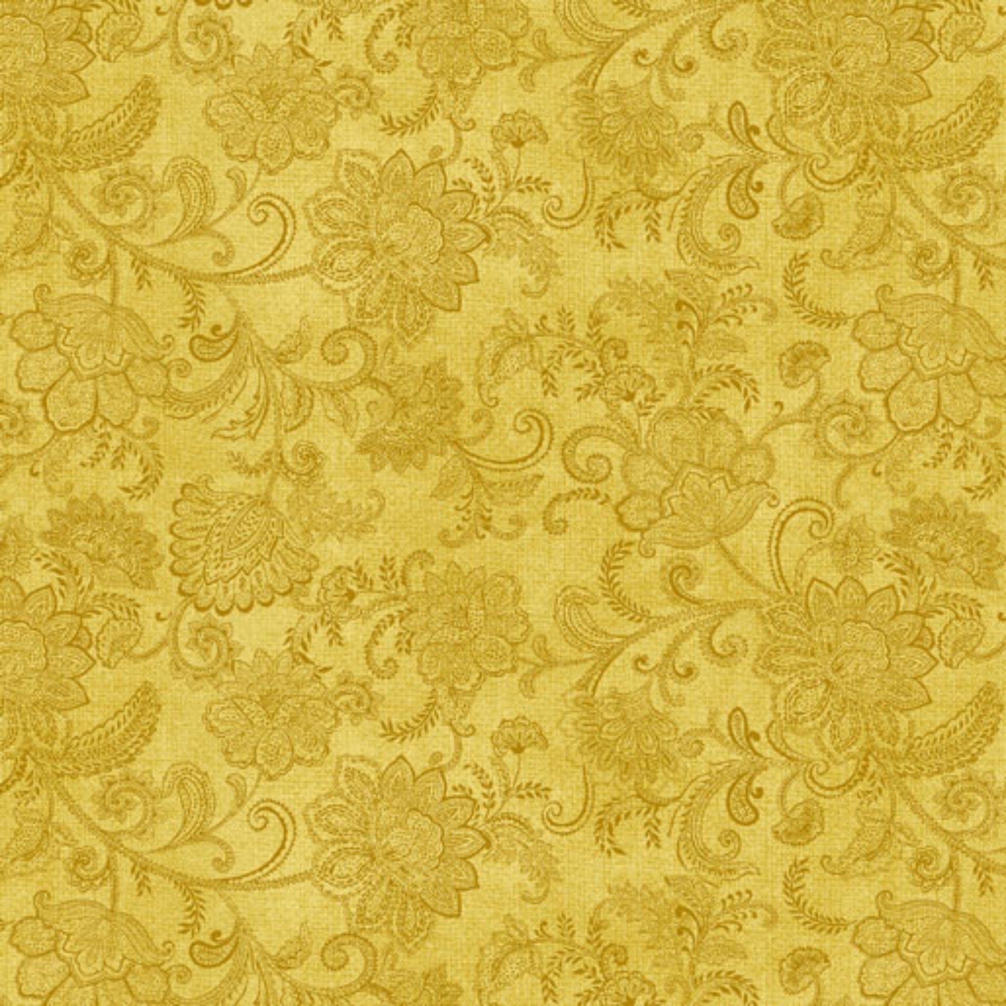 Tonal medium golden yellow quilting fabric with a detailed all-over Jacobean floral paisley pattern