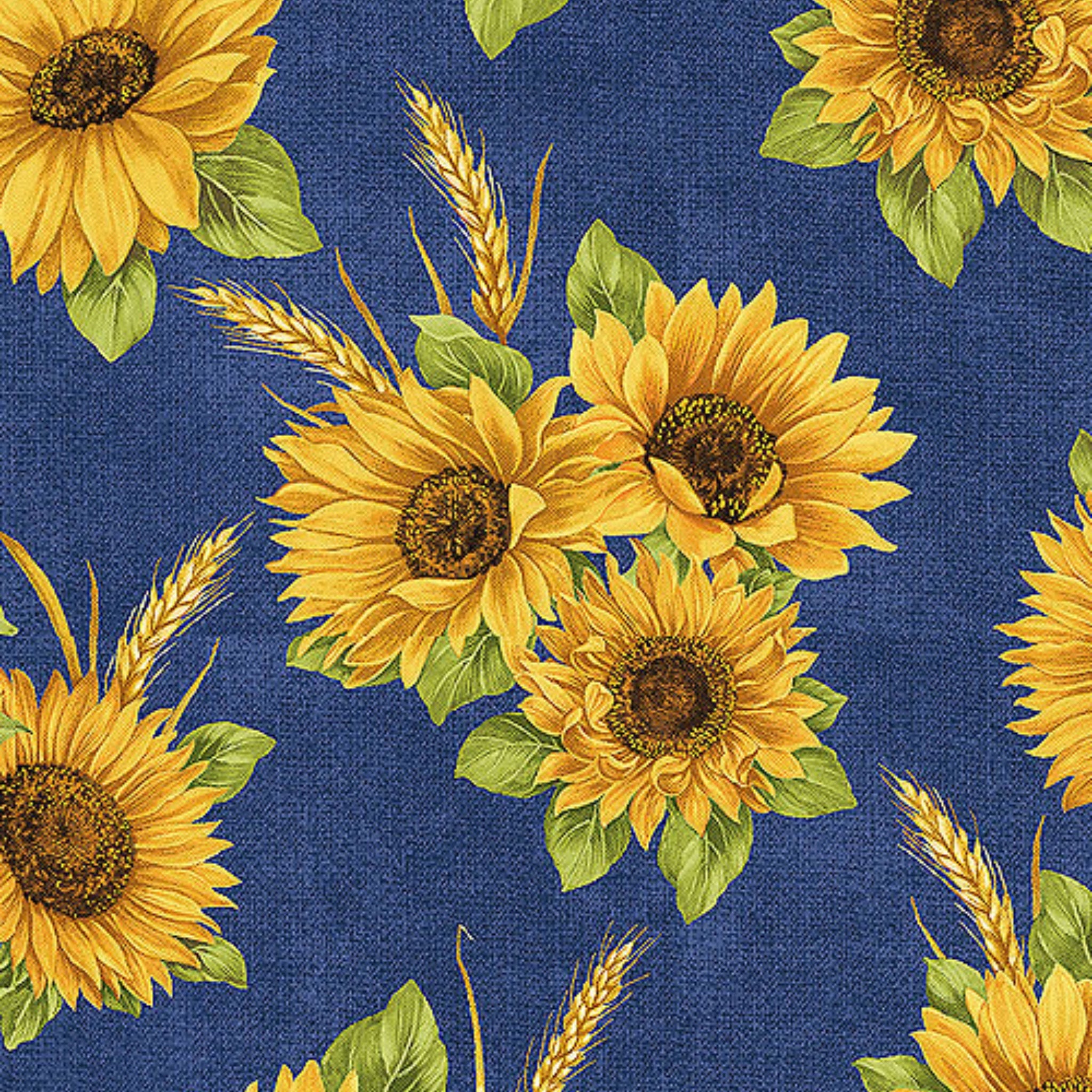 Quilting fabric with bright yellow sunflowers and wheat sheaves on a deep indigo blue background