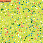 Lime green fabric with scattered stars, comets, and moons that glow in the dark
