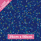 Navy blue fabric with white, blue, and lime green dots and orbital lines that glow in the dark