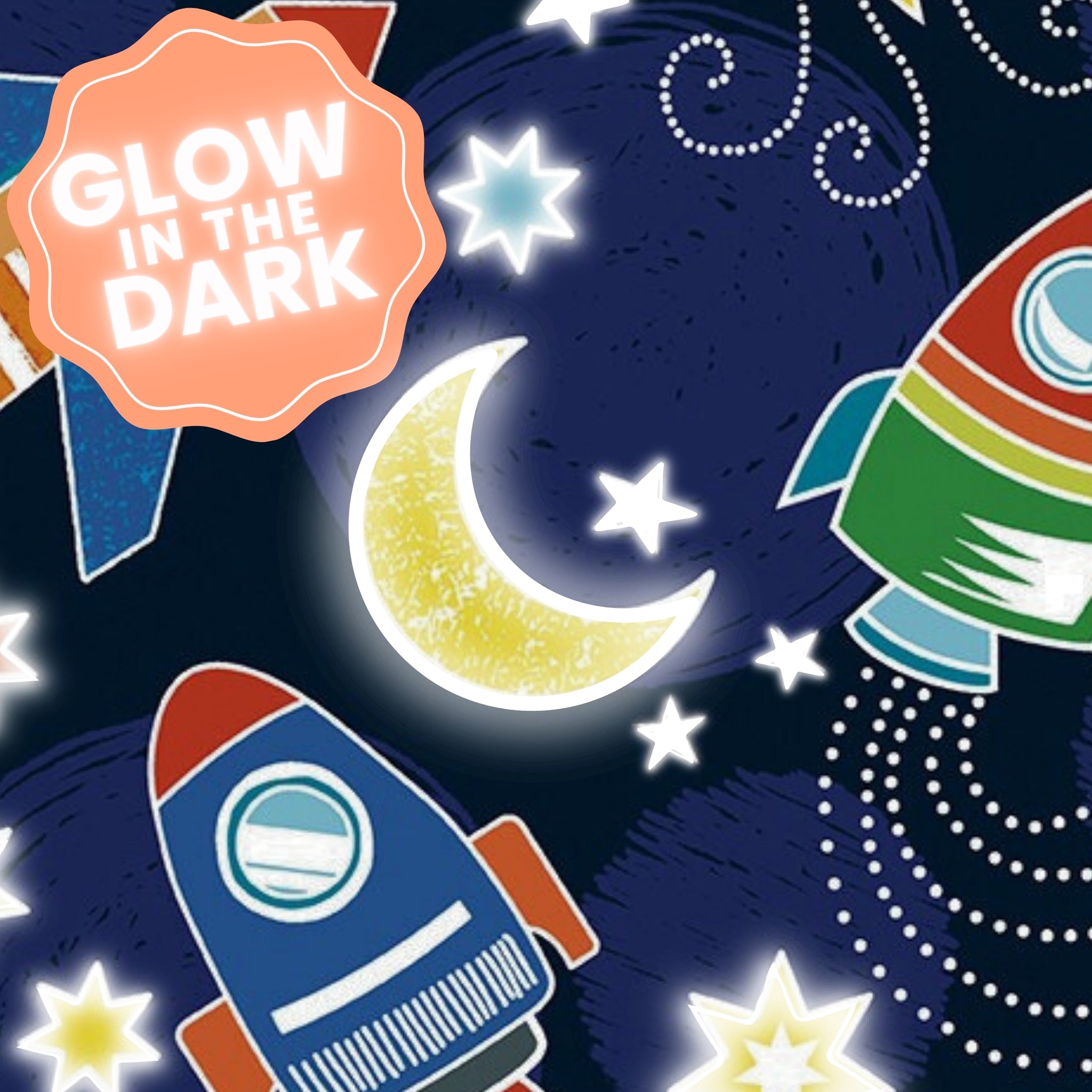 Navy blue fabric with colourful rockets, yellow moons, and stars that glow in the dark