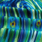 Closeup ornate peacock tail feathers digital print panel in blue and green with decorative border on quilting cotton fabric