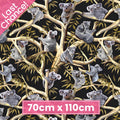 Realistic koalas eucalyptus gum trees golden branches black fabric for Australian themed quilts wildlife gifts and flora fauna patchwork sewing projects