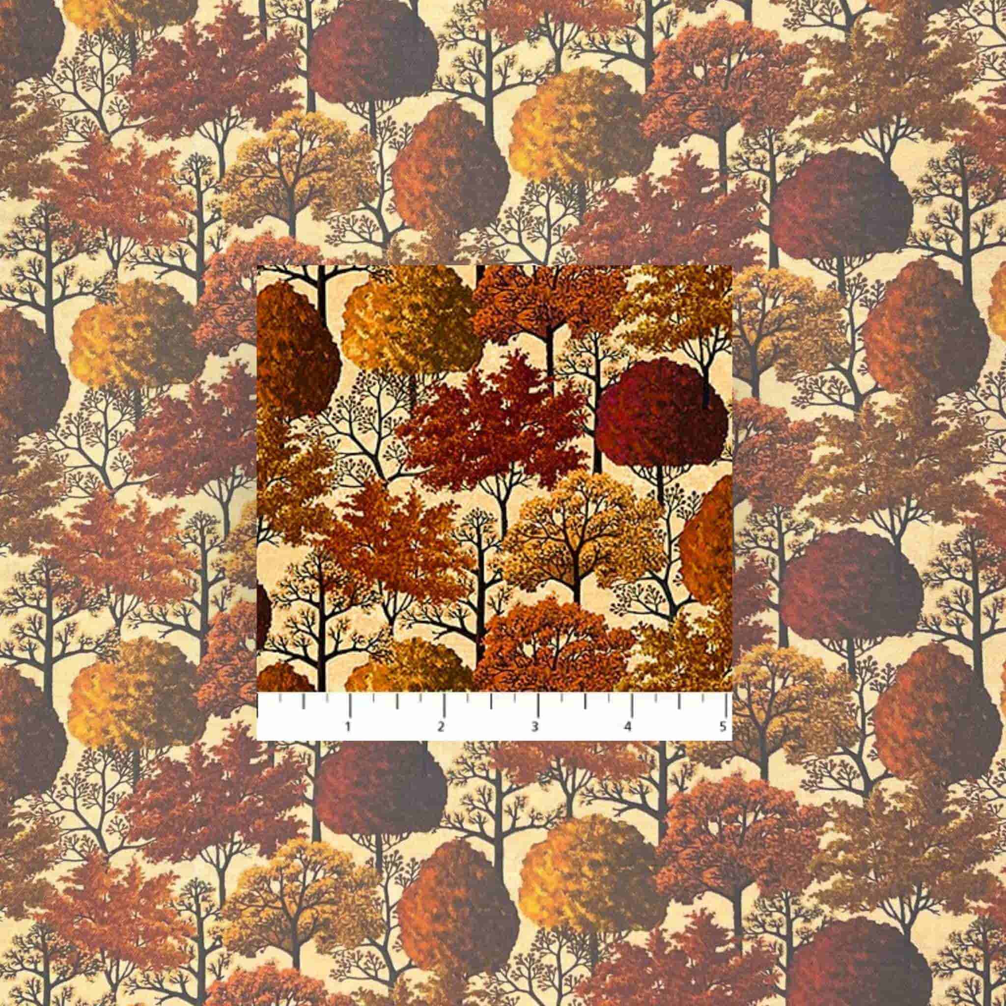 Fabric with autumn tree pattern and a ruler for scale on a beige background