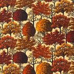 Pattern of autumn trees with red, orange, and brown leaves on a beige fabric quilting cotton