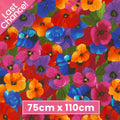 Packed pansy print red orange pink purple blue yellow floral fabric for feature quilts bags and vibrant patchwork sewing projects