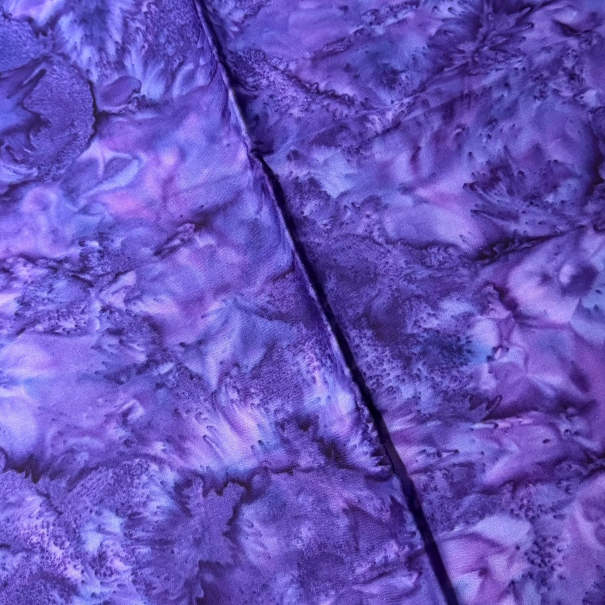 Deep grape-purple batik blender with blue-violet and lavender agate effect for quilt backgrounds sashing and scrappy batik quilts