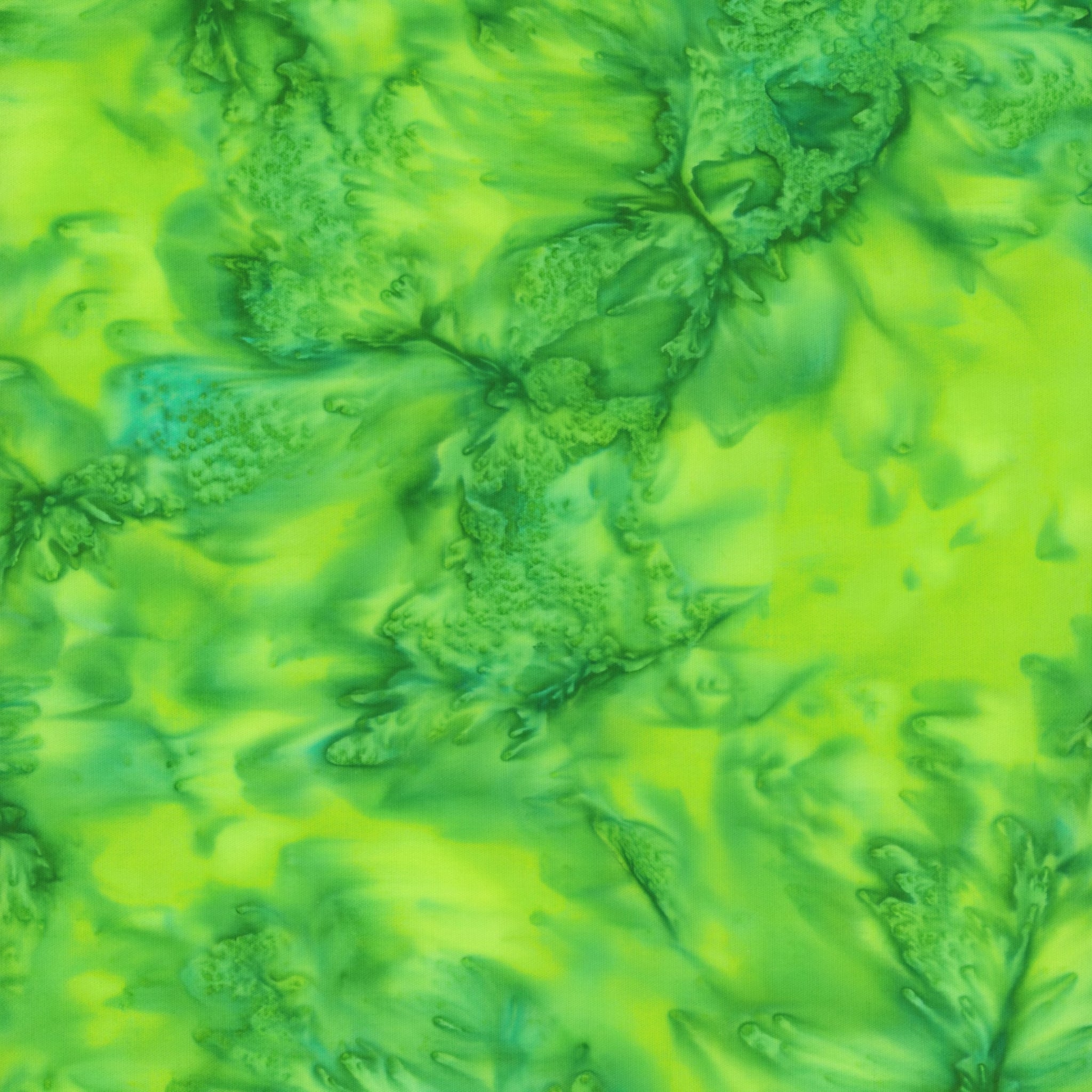 Vivid lime clover green mottled batik blender fabric with emerald and teal undertones for quilt backgrounds sashing and scrappy batik quilts