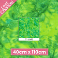 Vivid lime clover green mottled batik blender fabric with emerald and teal undertones for quilt backgrounds sashing and scrappy batik quilts