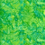 Vivid lime clover green mottled batik blender fabric with emerald and teal undertones for quilt backgrounds sashing and scrappy batik quilts