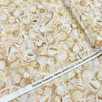 Packed seashells scallops spiral shells conch starfish sand dollars cream white beige natural coastal quilting fabric beach quilts seaside projects