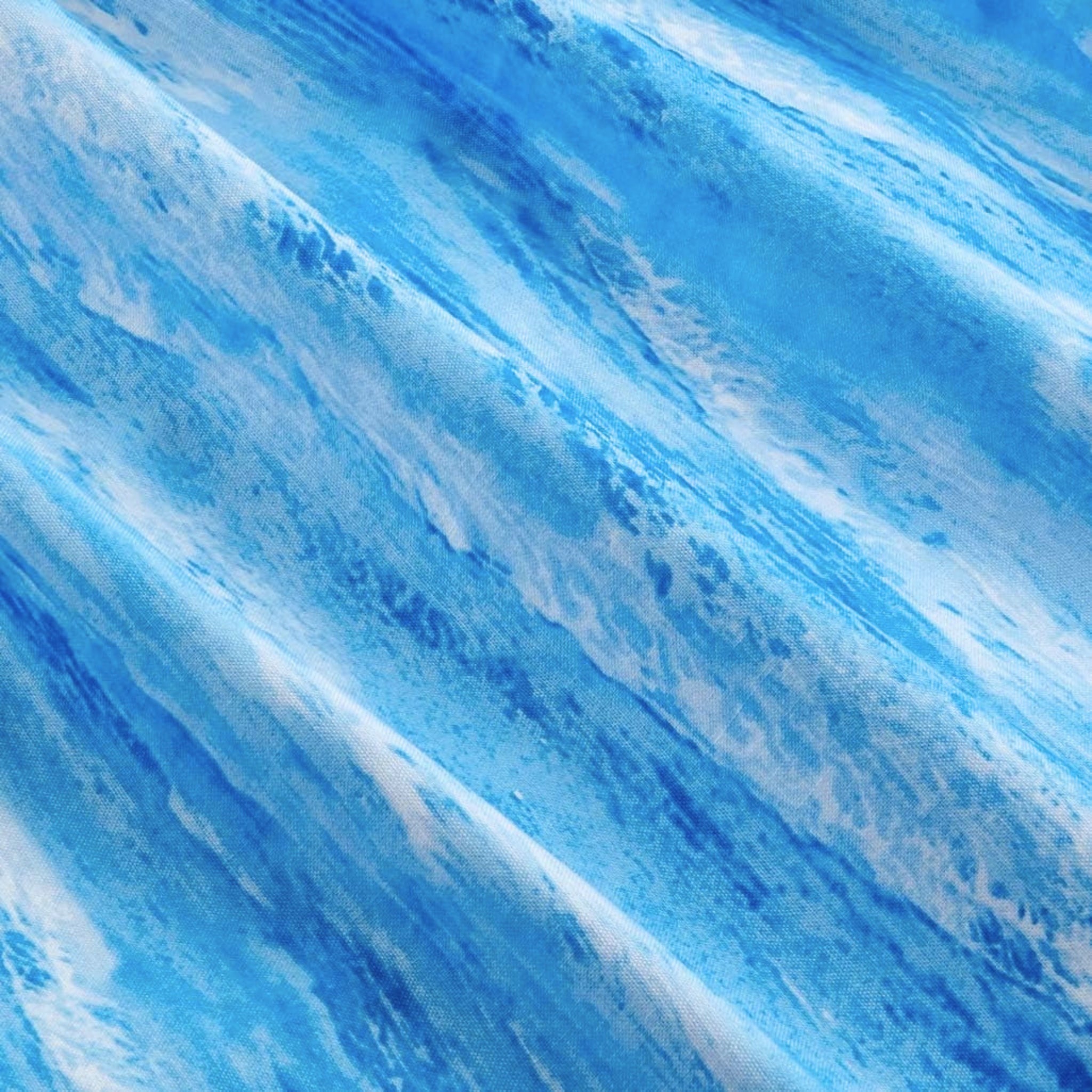Ocean waves aqua cobalt blue white sea foam detail closeup blue blender quilting fabric beach coastal sewing projects