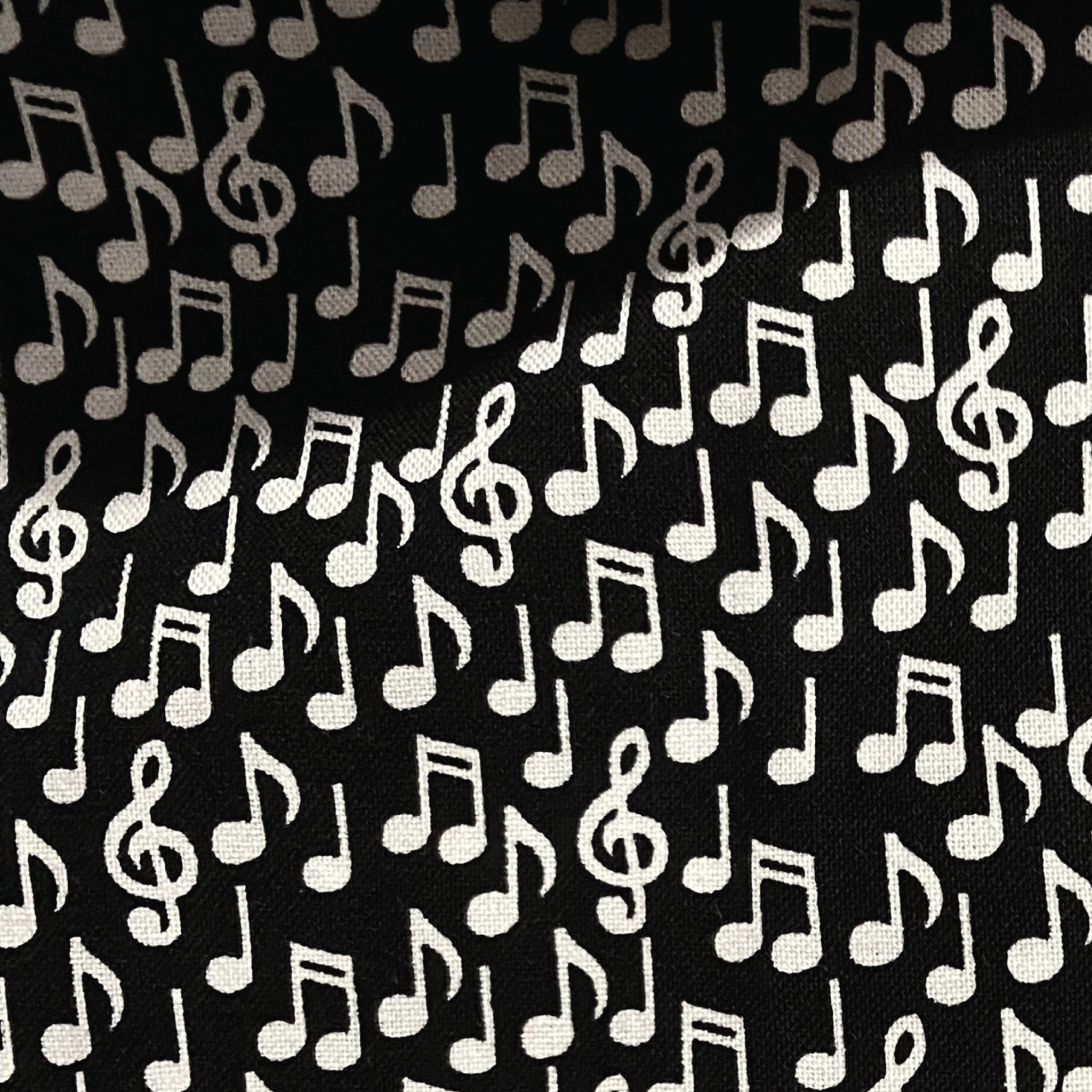 Tossed music notes quavers treble g clefs eighth notes white black novelty music fabric for music lovers quilts teacher gifts bags and patchwork sewing
