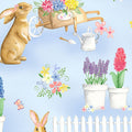 Cute brown bunnies spring garden blue fabric with potted flowers butterflies picket fences watering cans for children's quilts Easter projects and nursery décor
