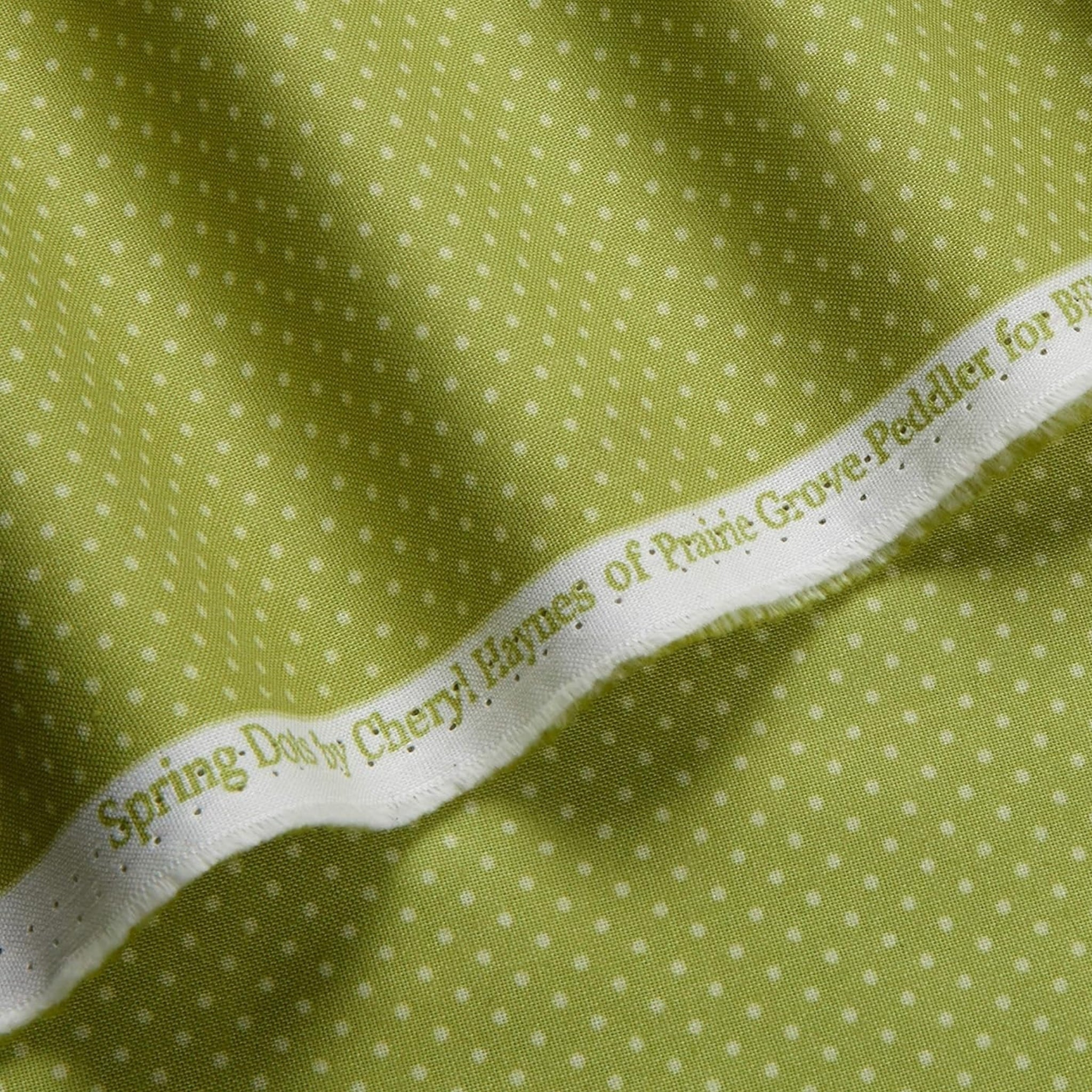White polka dot blender lime green fabric for spring quilt backgrounds sashing nursery projects and patchwork sewing