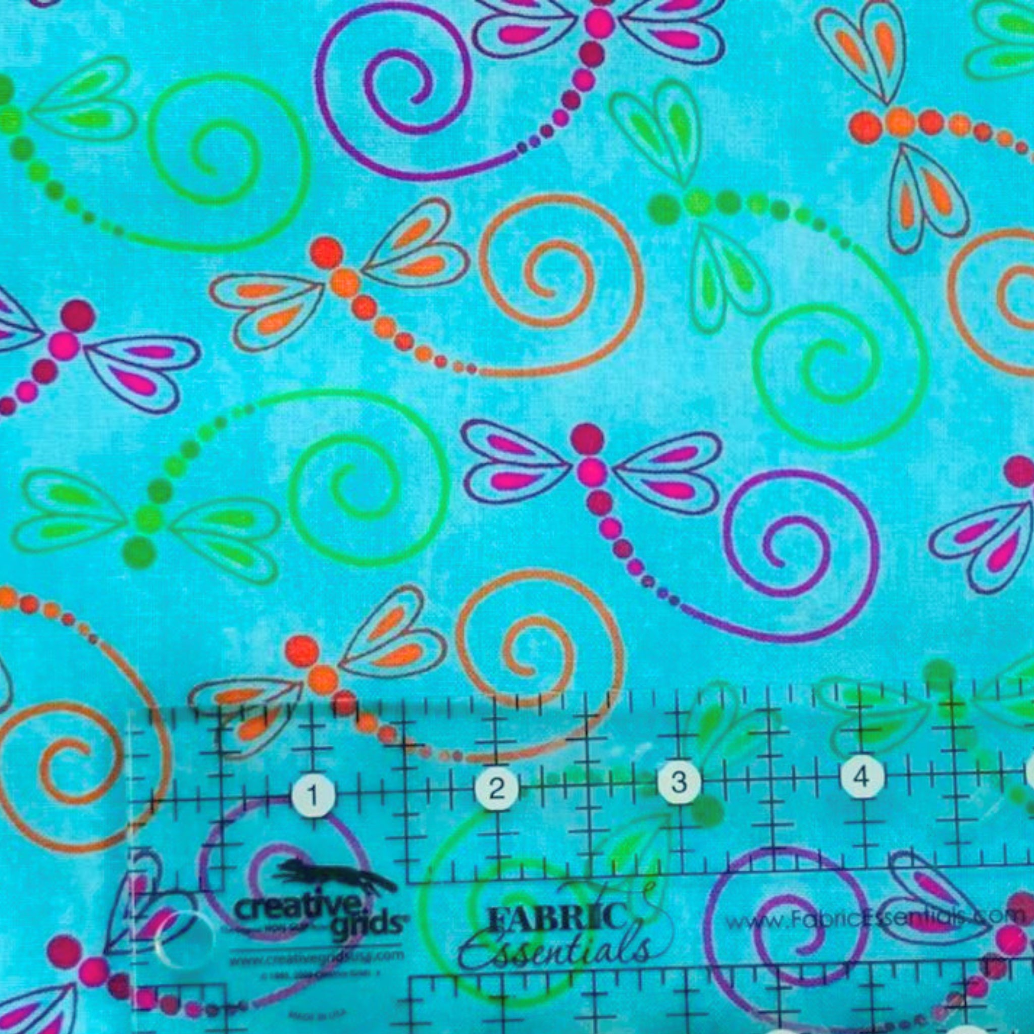 Novelty dragonfly swirl turquoise fabric pink green orange purple for nature quilts children's projects and garden gifts