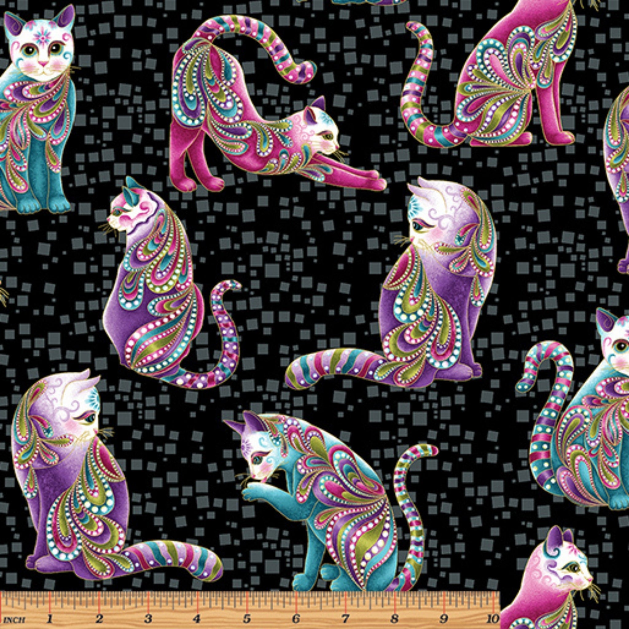 Black fabric with large pink, purple, and teal paisley-patterned cats and gold metallic accents