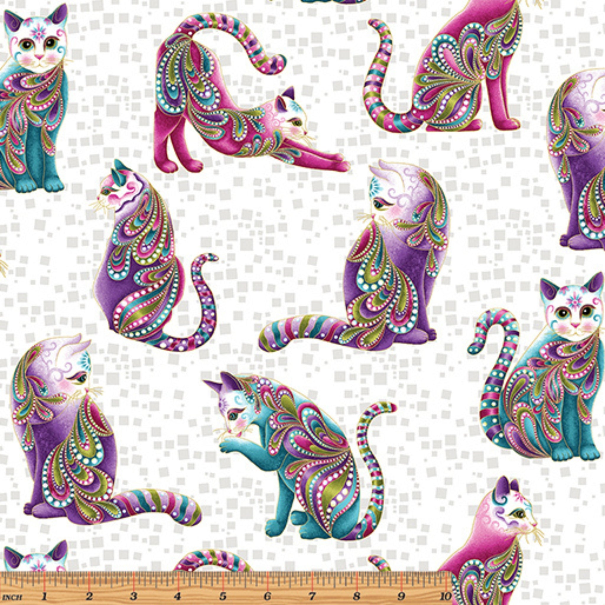 White fabric with pink, purple, and teal paisley patterned cats and gold metallic accents