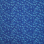 Tonal blue fabric with an all-over pattern of scattered light and royal blue geometric squares