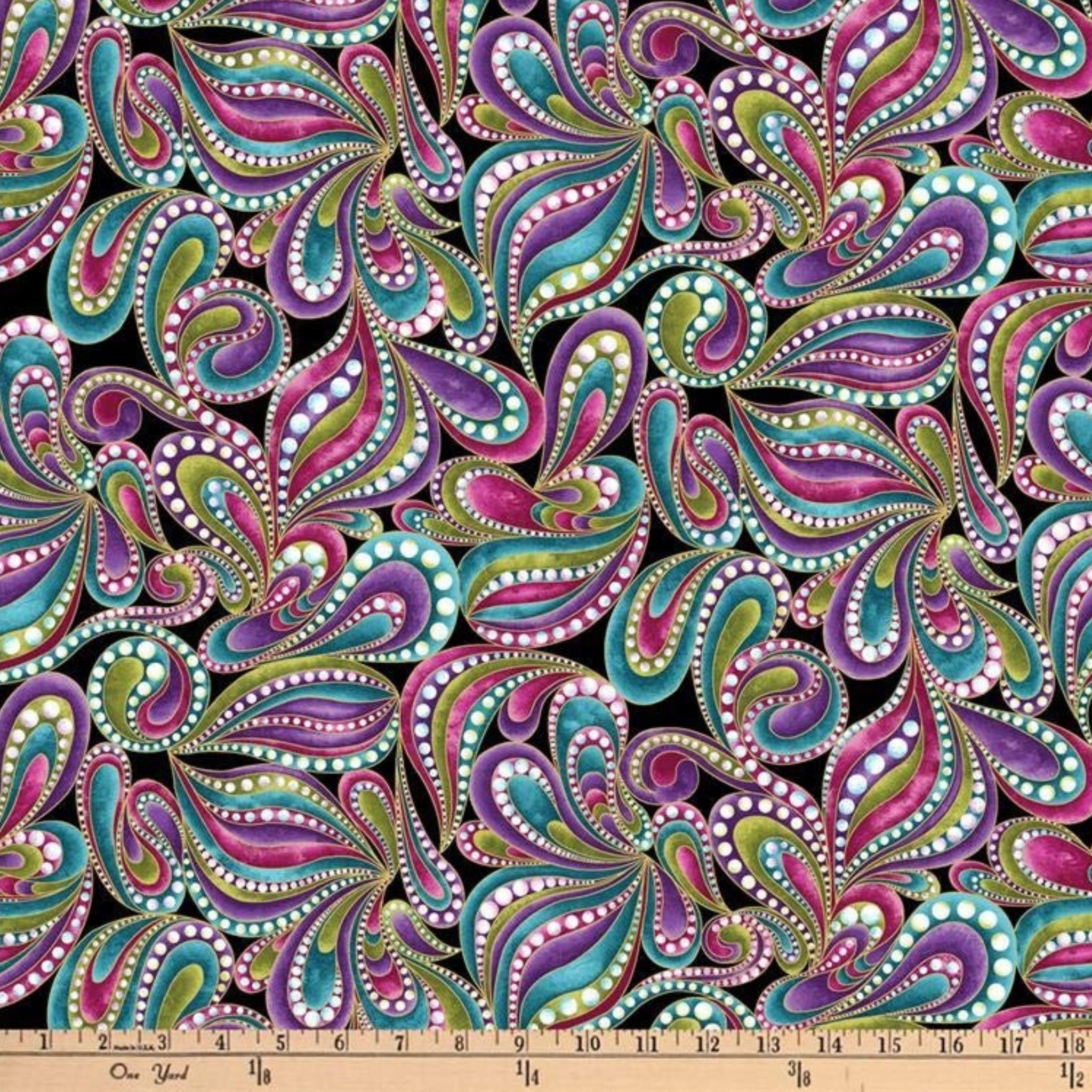 Black fabric with paisley shapes in purple, teal, pink, and lime green outlined in gold metallic