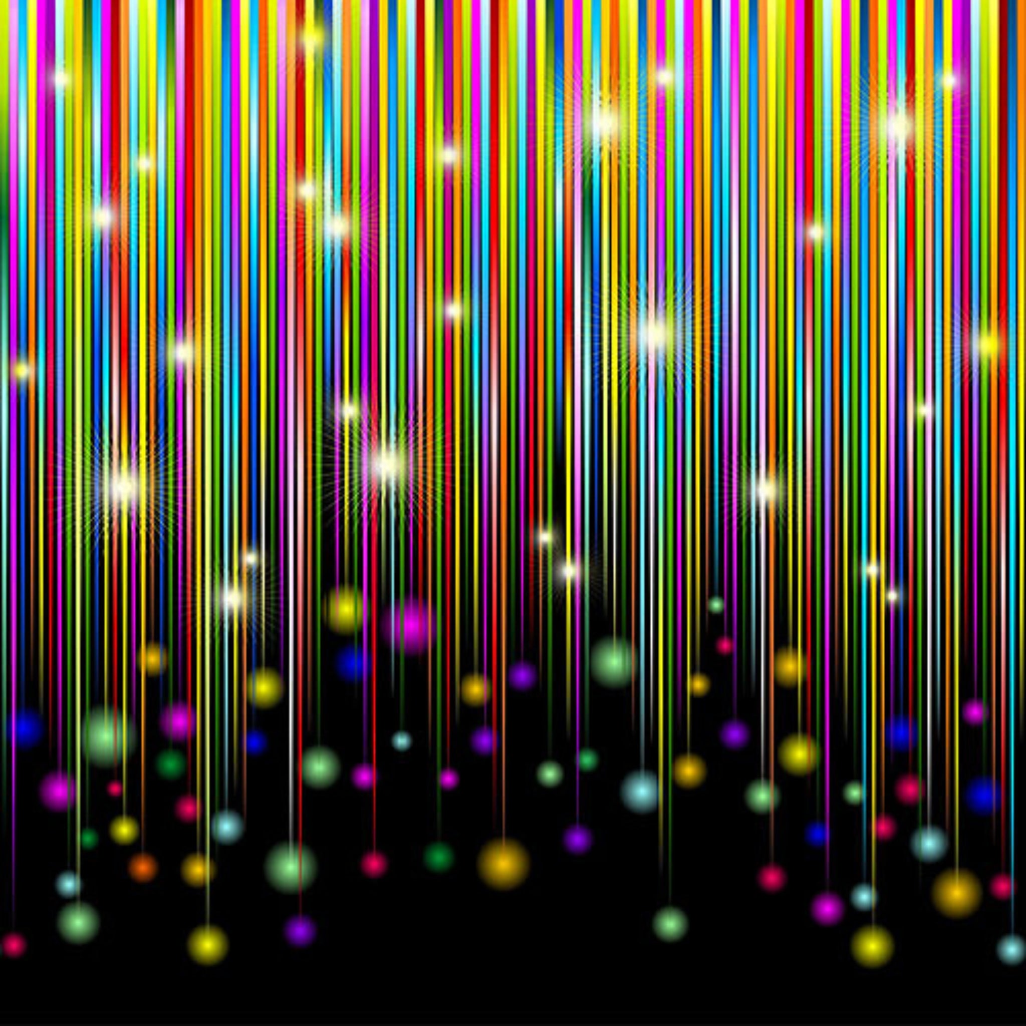 Rainbow star trails border print in vibrant multi colours on black background fabric for holiday quilts and patchwork sewing projects