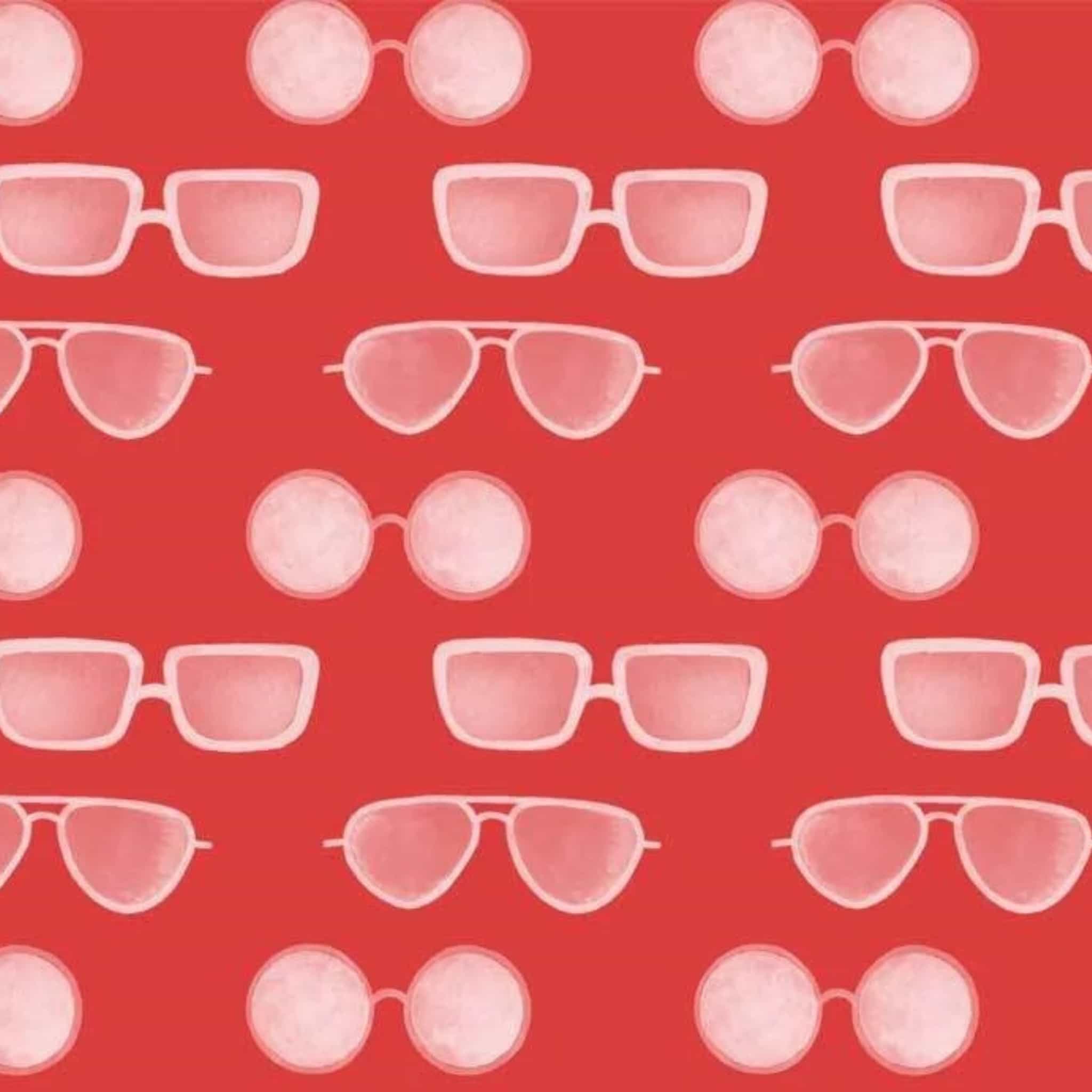 Colourful sunglasses on red cotton fabric for beach quilts, summer tote bags and coastal sewing projects