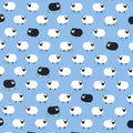 White and black sheep tossed flock blue background novelty quilting fabric for baby quilts nursery décor and children's sewing