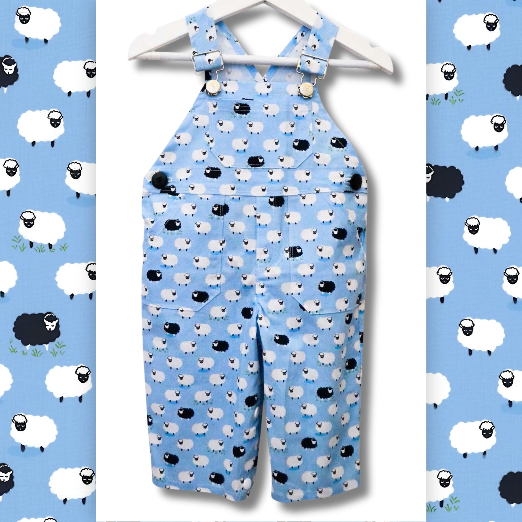Counting Sheep Following Ewe blue sheep fabric made into children's dungarees overalls with white and black sheep print on blue background