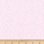 Scattered pink dash stitch marks white background blender quilting fabric for backgrounds sashing baby quilts girls quilts and patchwork projects