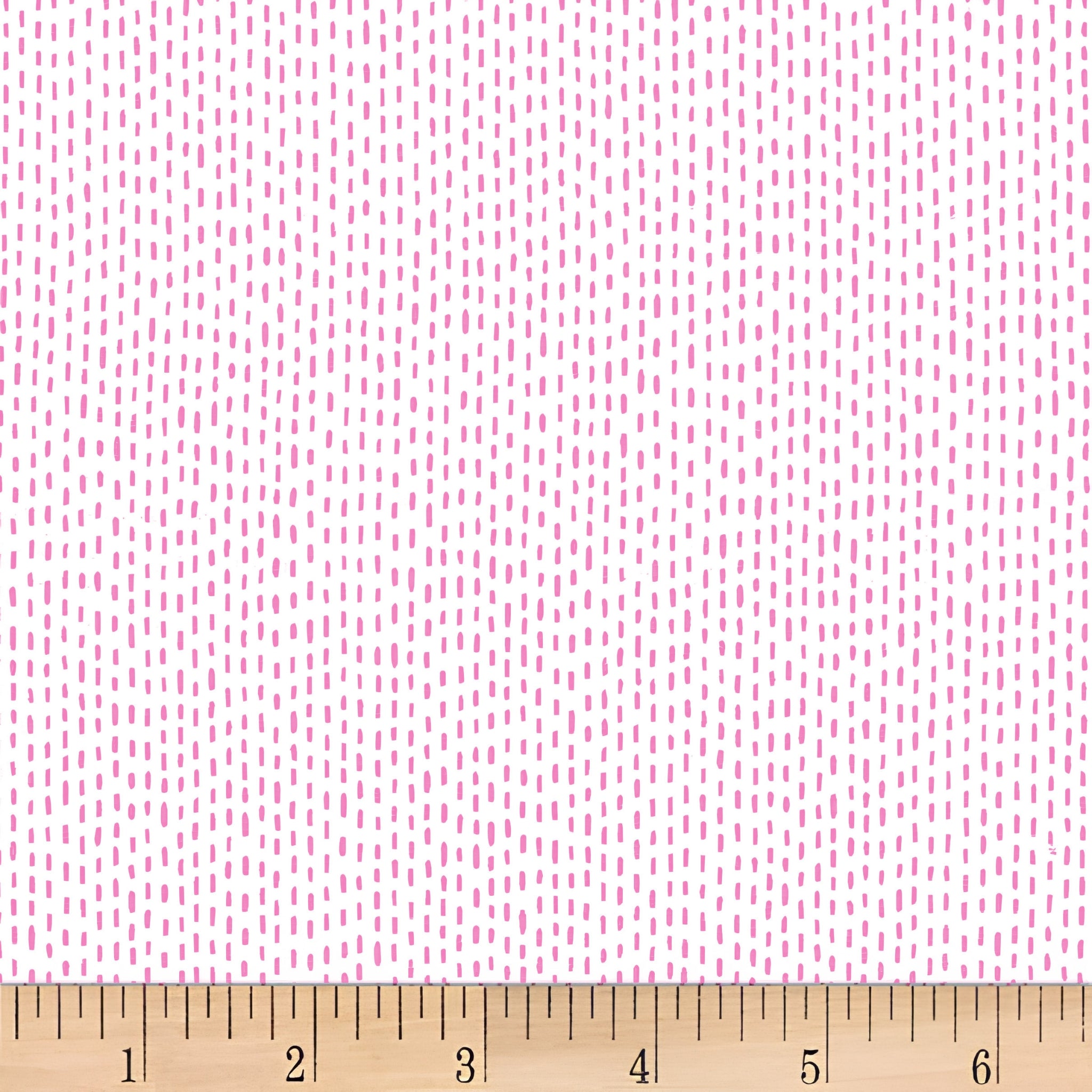 Scattered pink dash stitch marks white background blender quilting fabric for backgrounds sashing baby quilts girls quilts and patchwork projects