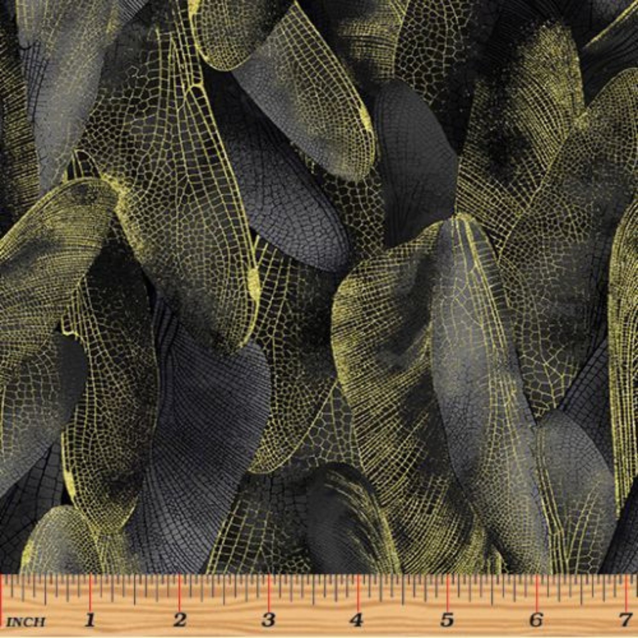 Black and charcoal gray quilting fabric with a pattern of metallic gold dragonfly wings