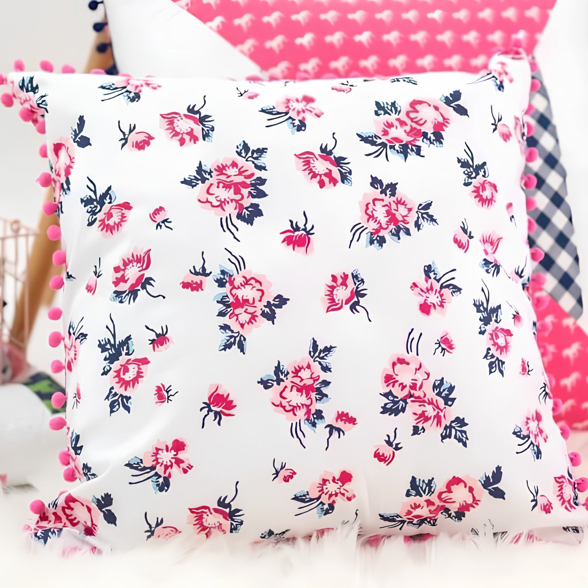 Derby Day vintage floral roses pink blush navy quilting fabric made into a cushion cover with pink pom pom trim