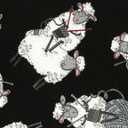 Knitting sheep novelty black fabric with yarn balls and needles for quilts bags and knitter gifts patchwork sewing projects