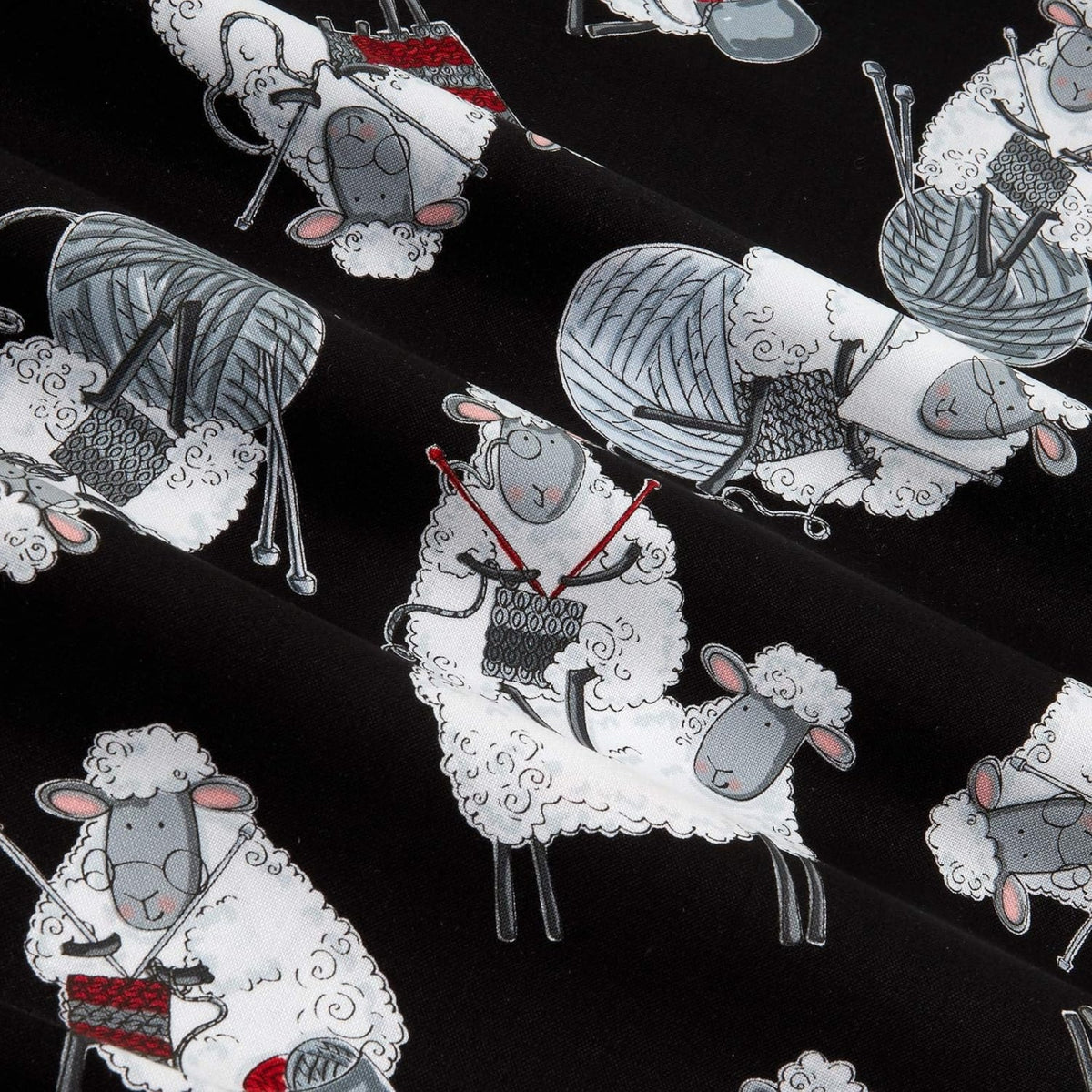 Knitting sheep novelty black fabric with yarn balls and needles for quilts bags and knitter gifts patchwork sewing projects