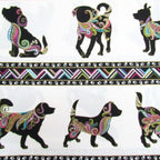 Decorative fabric with black dog silhouettes and colorful patterns on a white background.
