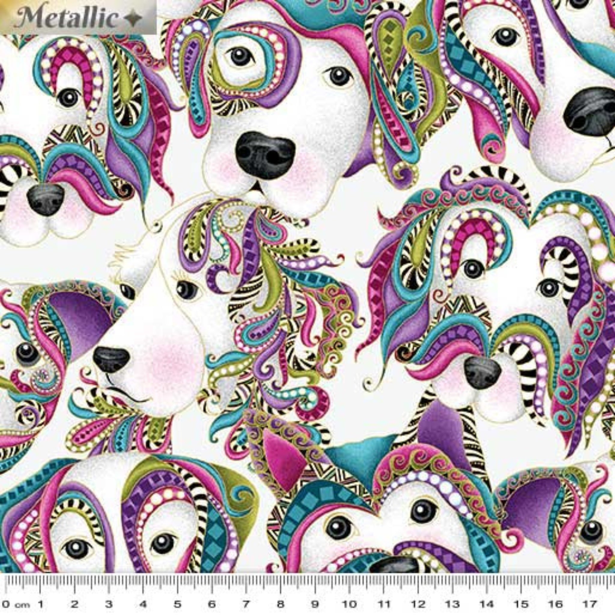 White fabric with large dog faces decorated with colourful paisley and gold metallic