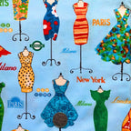 Vintage dresses on ornate dress stands Paris London New York Milano city names sky blue novelty quilting fabric patchwork sewing projects