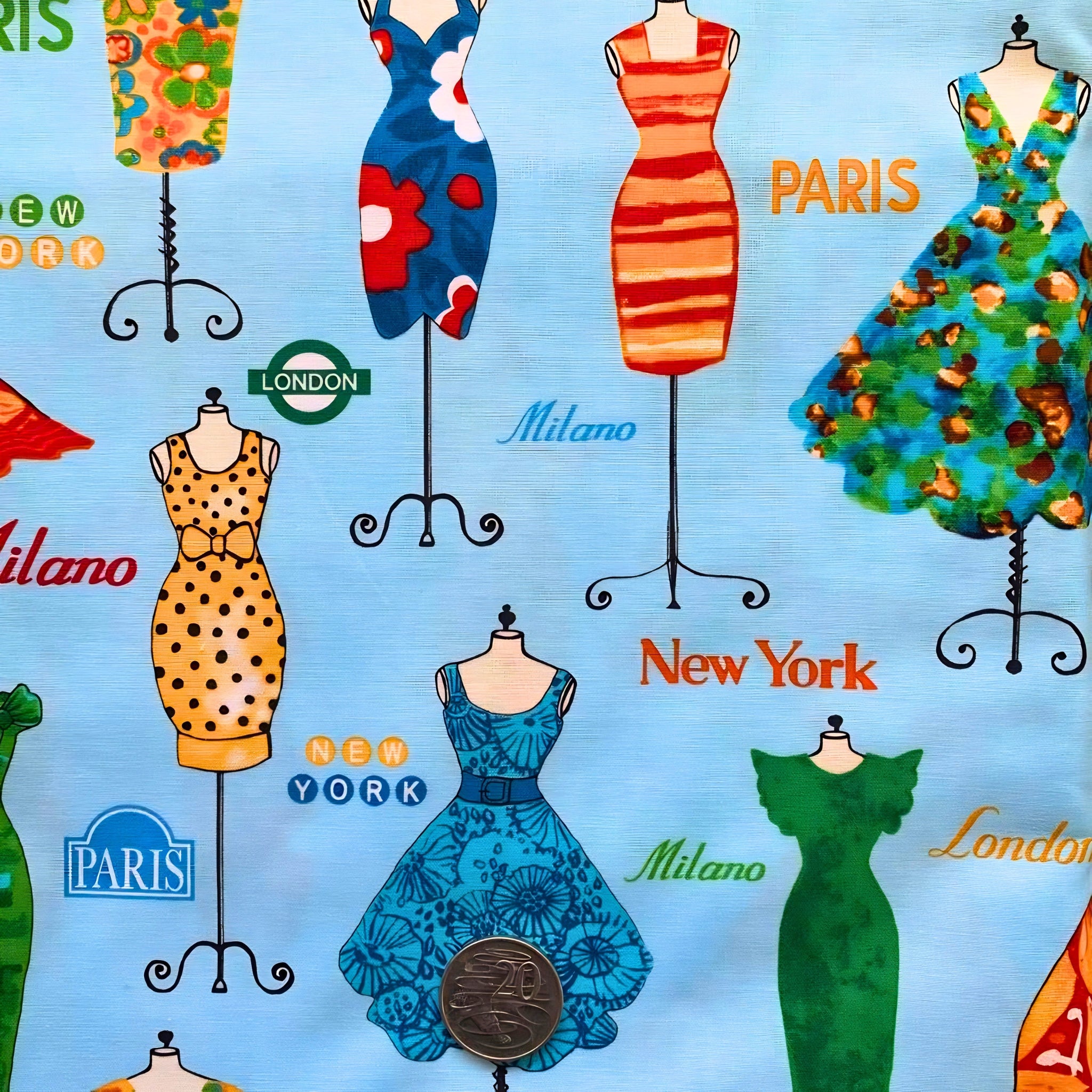 Vintage dresses on ornate dress stands Paris London New York Milano city names sky blue novelty quilting fabric patchwork sewing projects