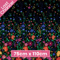 Embroidered-look floral border print black fabric graduating from small buds to bold blooms for quilt borders cushion covers tote bags and sewing projects