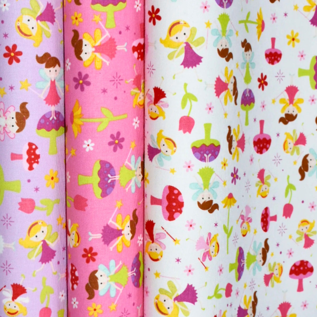 Fairy Garden Toss fairy fabric in purple pink and white colourways for girls quilts nursery décor and novelty patchwork sewing projects